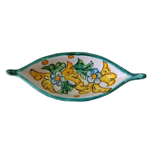 Assiette en forme de bateau. ligne de fleurs. Céramique...