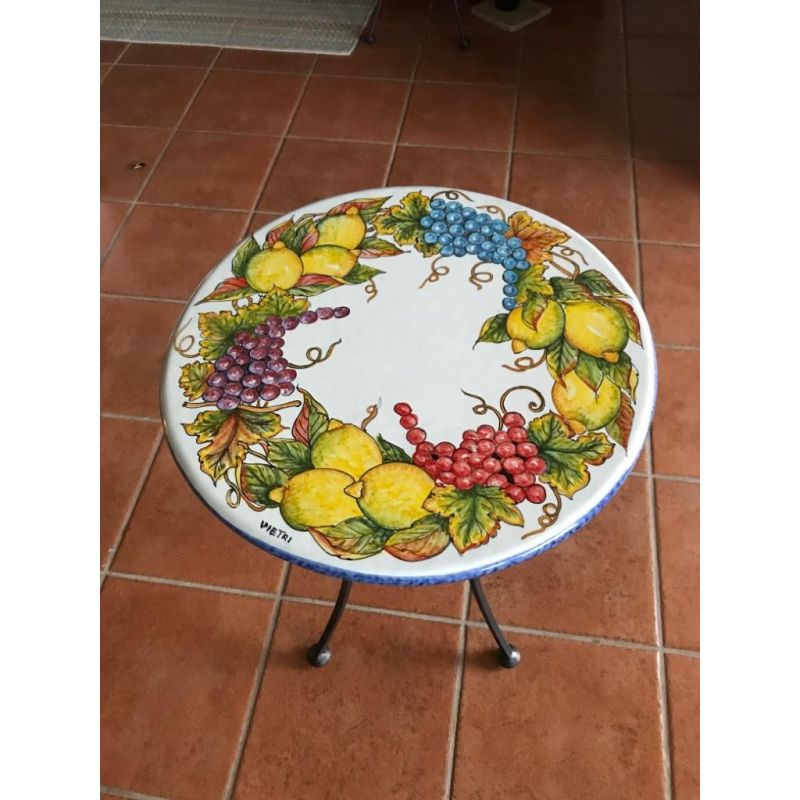 Table. Ceramic-coated lava stone table. Grapes...