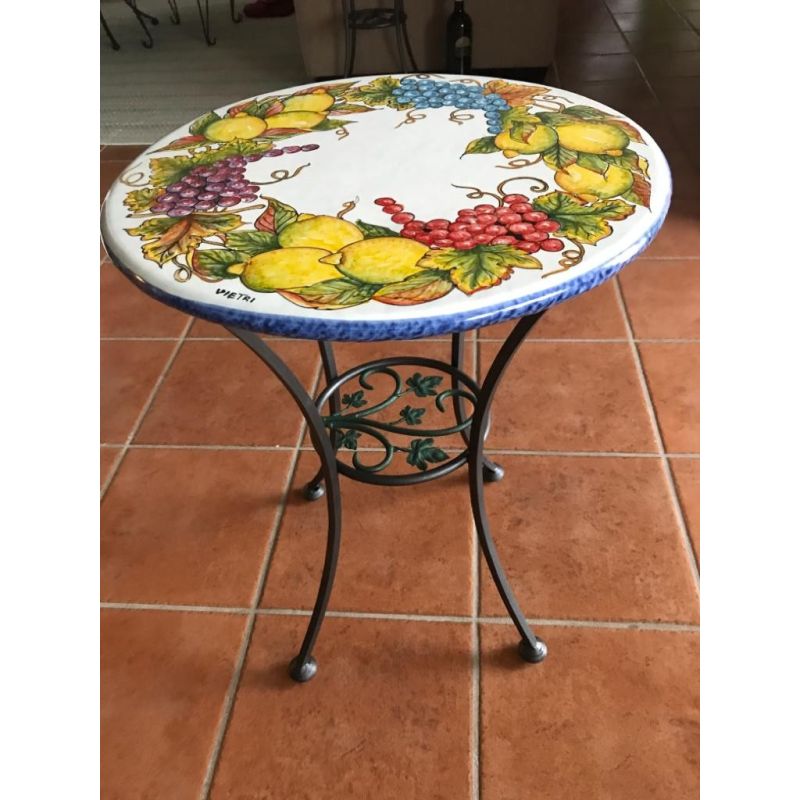 Table. Ceramic-coated lava stone table. Grapes...