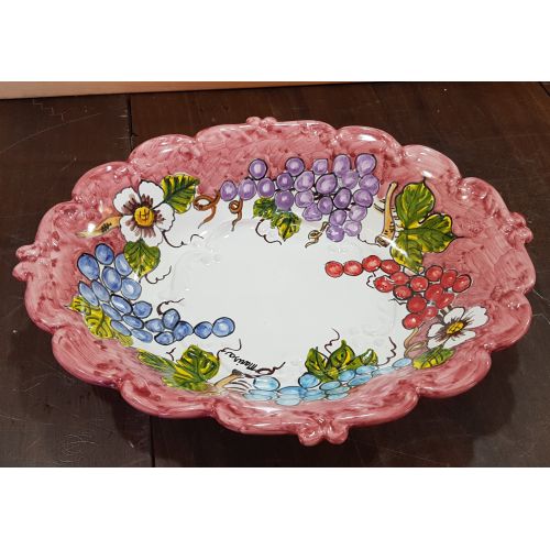 Centrotavola ovale bordo ondulato rosso vecchio, decoro frutta. Ceramica di Vietri