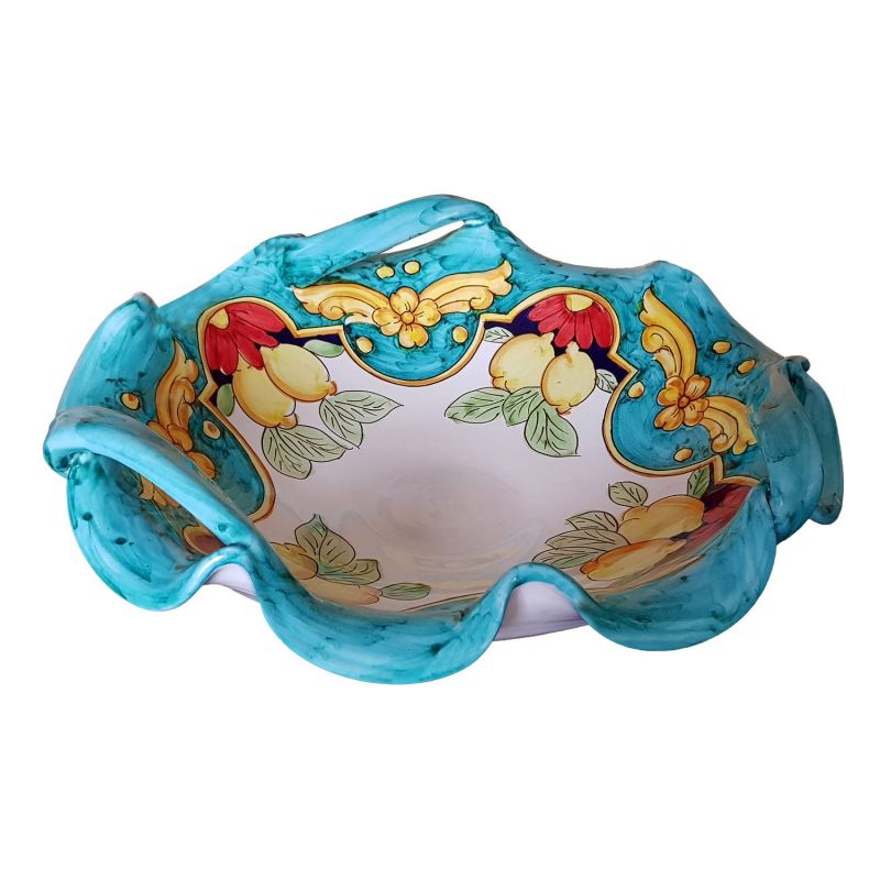 Centerpiece bowl with 3 handles. Wavy rim....