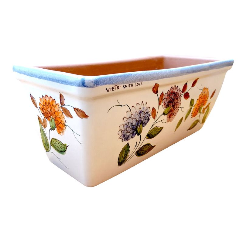 Jardinera rectangular. Fondo blanco con flores....