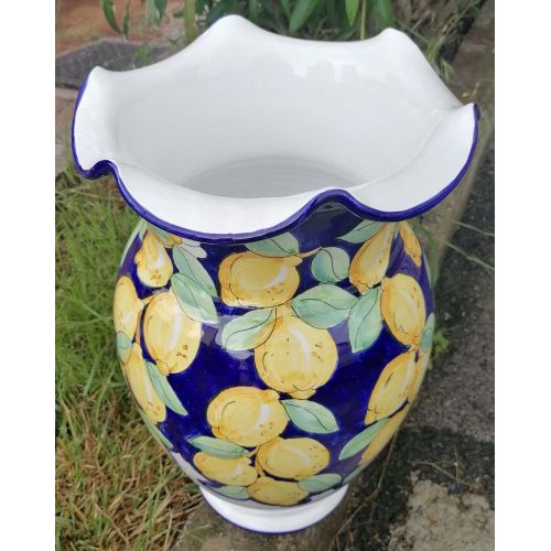 Umbrella holder vase Blue background and lemons...